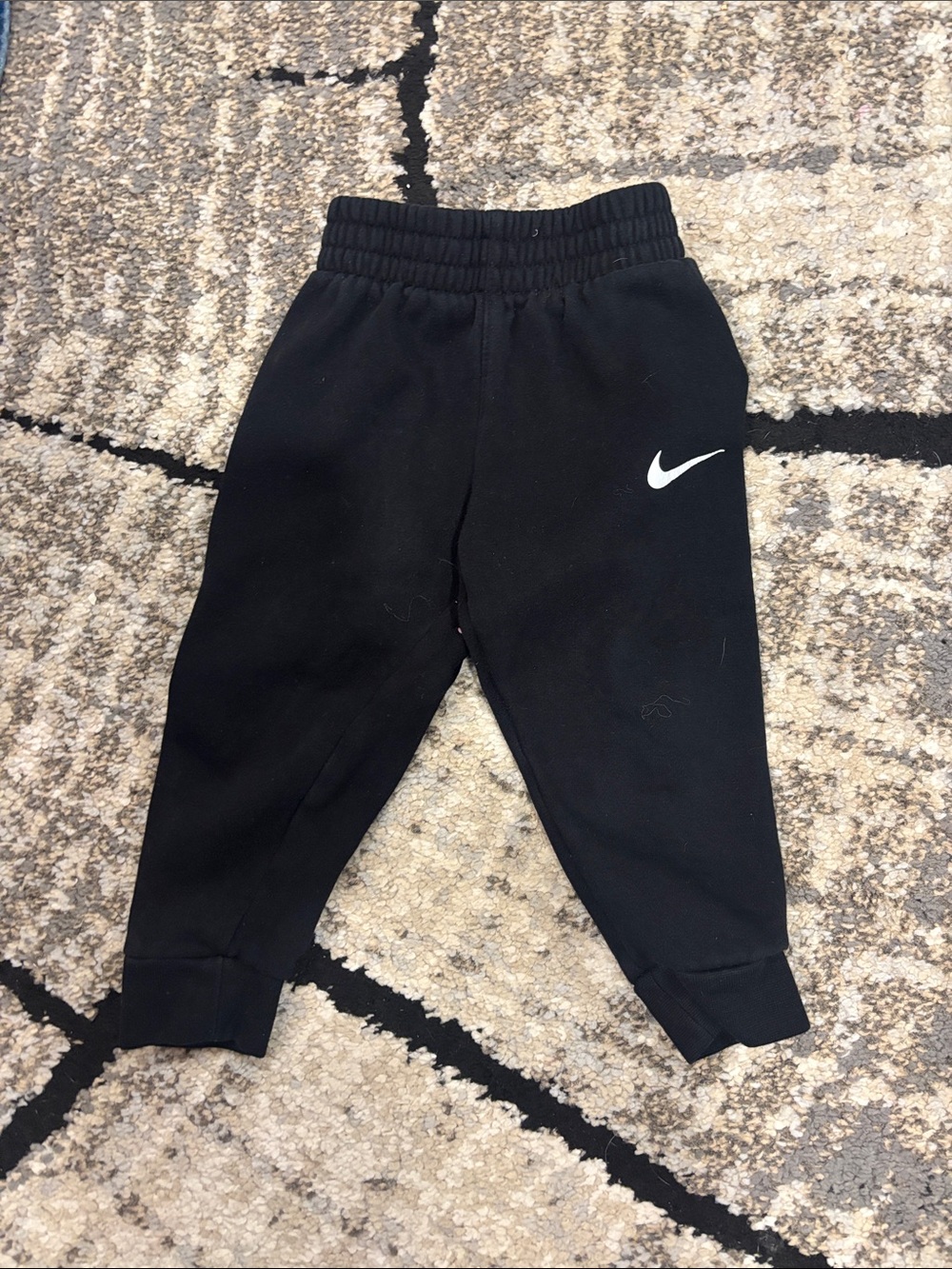 Nike Kids Black Joggers with White Swoosh Accent